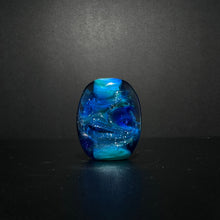 Purple Sea Horse Bead on an Ocean Themed Back Ground with Dichroic.