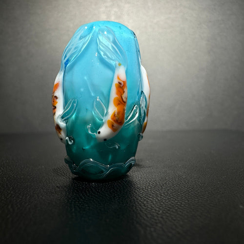 Koi on a teal bead.  Teal to blue fade, Koi Fish, Koi Pond,