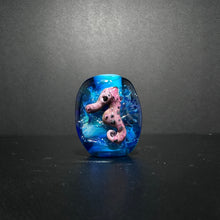 Purple Sea Horse Bead on an Ocean Themed Back Ground with Dichroic.