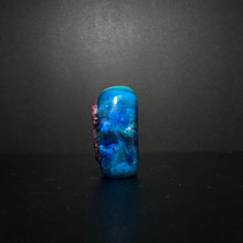 Purple Sea Horse Bead on an Ocean Themed Back Ground with Dichroic.