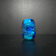 Purple Sea Horse Bead on an Ocean Themed Back Ground with Dichroic.