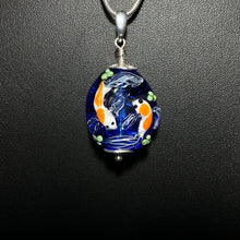 Koi Pond Pendant.  Two Koi Swimming Together on a Blue Background.