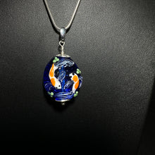 Koi Pond Pendant.  Two Koi Swimming Together on a Blue Background.