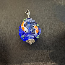 Koi Pond Pendant.  Two Koi Swimming Together on a Blue Background.