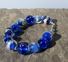 Blue and silver bracelet- blue glass beads with sterling silver spacers  bracelet