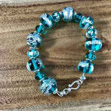 Handcrafted glass light teal and silver glass beaded bracelet.