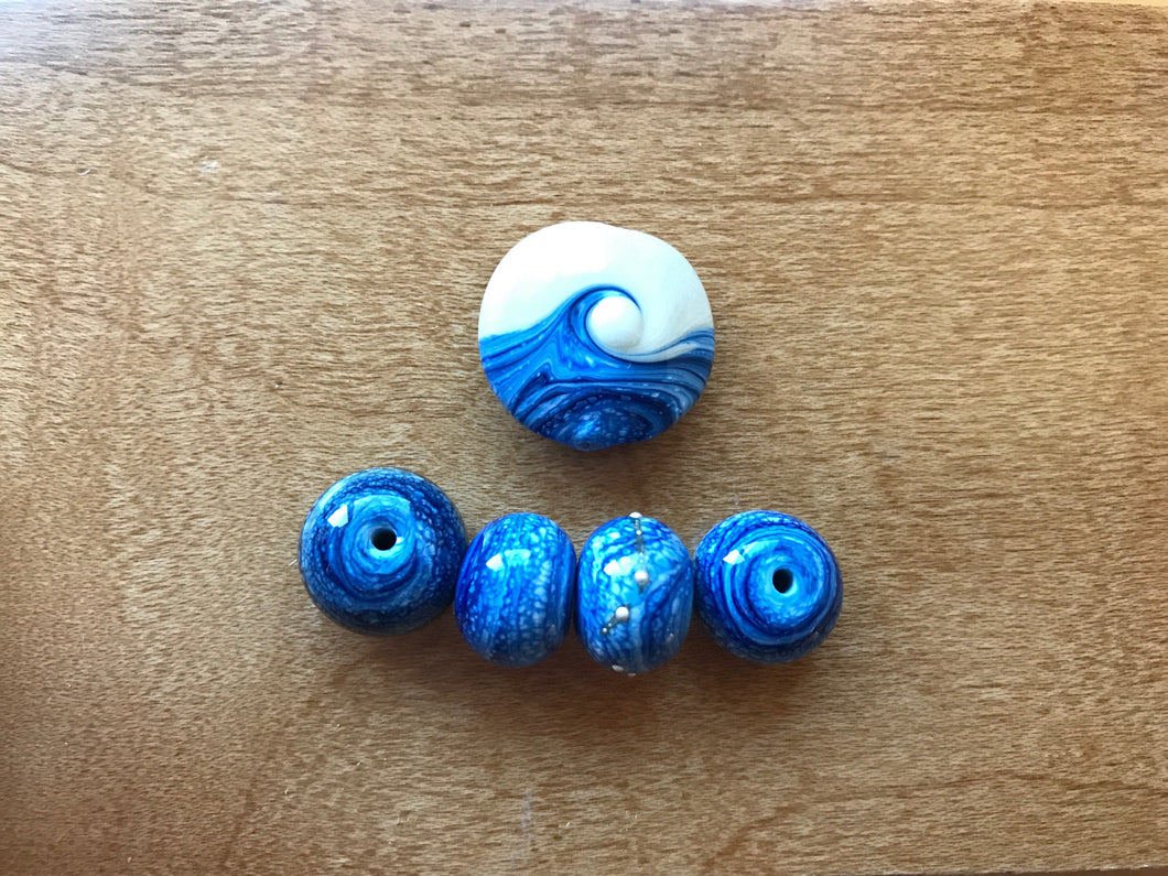 Blue and ivory wave bead and six spacer beads.  Denim beads.  Ocean inspired beads.