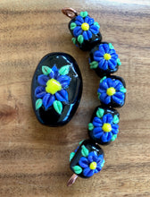 Periwinkle wild flower set.  Floral Beads.  Lampwork Beads. Purple blue flowers on black background.