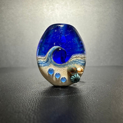 Large Blue Tide Pool Bead Intense blue with glittery dichroic and wisps of white.