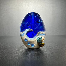 Large Blue Tide Pool Bead Intense blue with glittery dichroic and wisps of white.