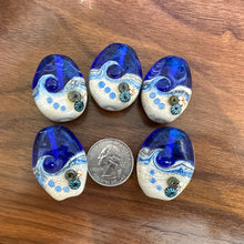 Large Blue Tide Pool Bead Intense blue with glittery dichroic and wisps of white.